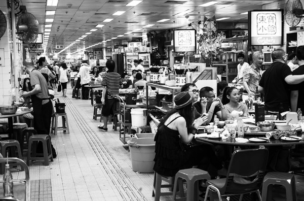 People, stools and tables at the North Point Wet Market